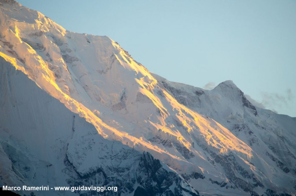 The wall of Mount Rakaposhi at sunset, Karakoram, Pakistan. Author and Copyright Marco Ramerini