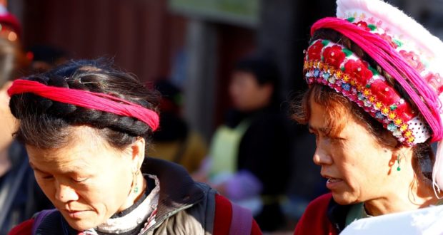 Women at the market in Zhoucheng, Yunnan, China. Author and Copyright Marco Ramerini