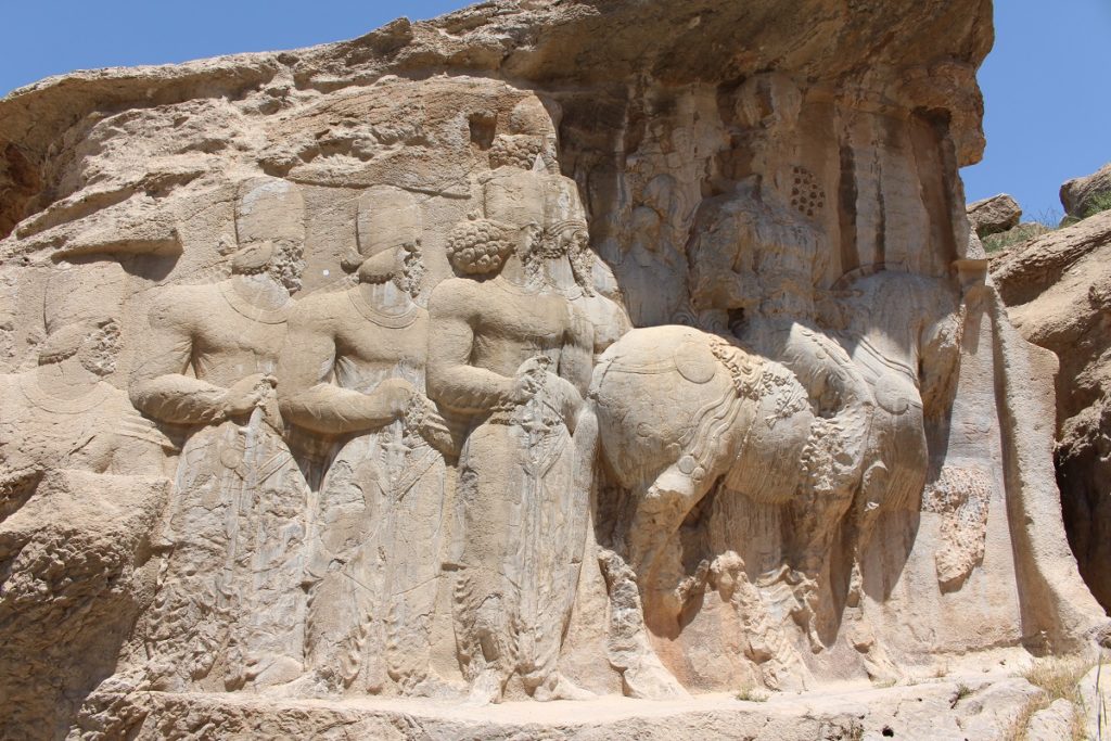 Shapur I on horseback, followed by members of his family and the highest dignitaries of the state, Naqsh-e Rajab, Iran. Author and Copyright Marco Ramerini