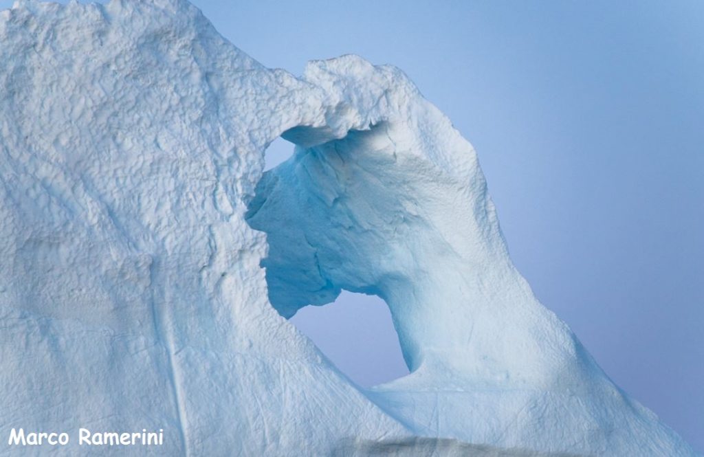 Holes in an iceberg, Greenland. Author and Copyright Marco Ramerini