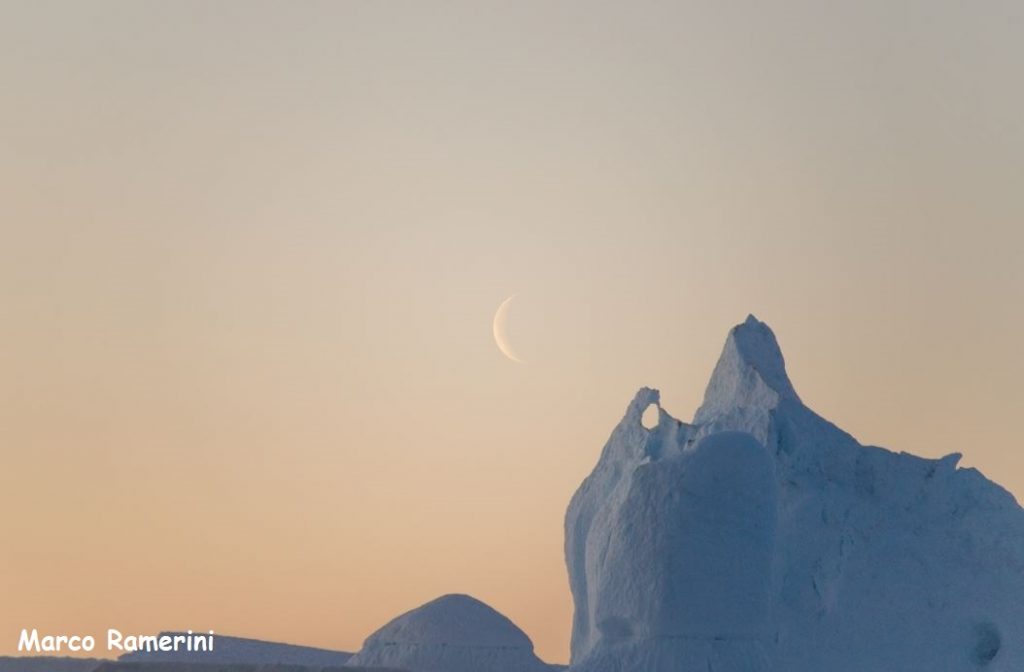Moon with icebergs, Greenland. Author and Copyright Marco Ramerini
